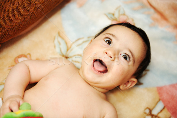 Stock photo: Adorable gorgeous baby laughing, portrait, outdoor