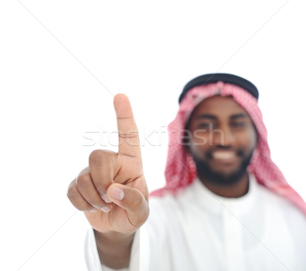 Arabian African man with finger on screen - ready for your messa Stock photo © zurijeta