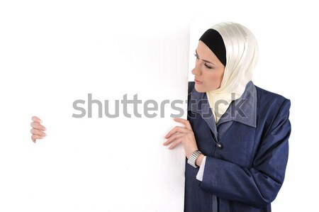 Beautiful Muslim fashion girl holding an empty banner, copy-space Stock photo © zurijeta