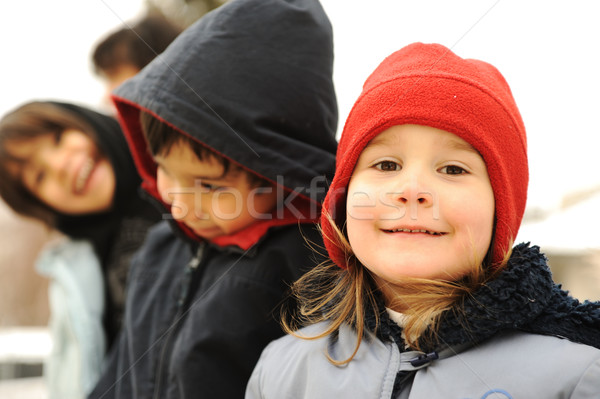 Happy group of children outdoor, winter clothes Stock photo © zurijeta