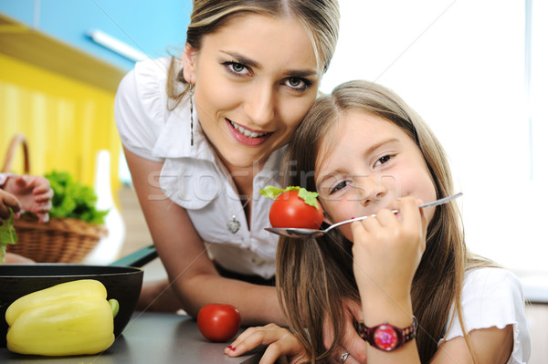 Stock photo: Mother and daughter cooking, love and work together