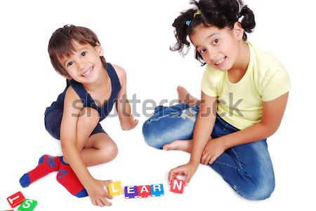 Children playing and learning in isolated background Stock photo © zurijeta