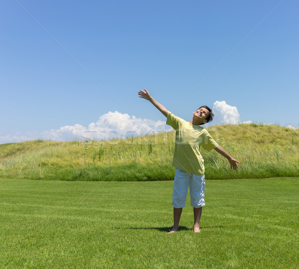 Boy with open hands in beautiful nature Stock photo © zurijeta