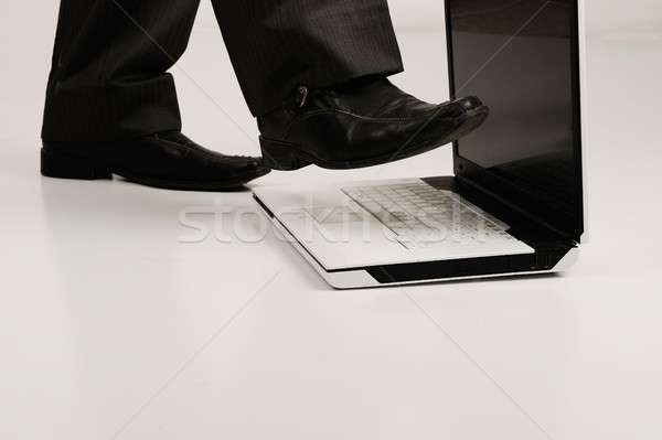 Business shoe steping and destroying laptop Stock photo © zurijeta