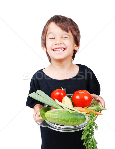 Boy with vegetables in hands Stock photo © zurijeta