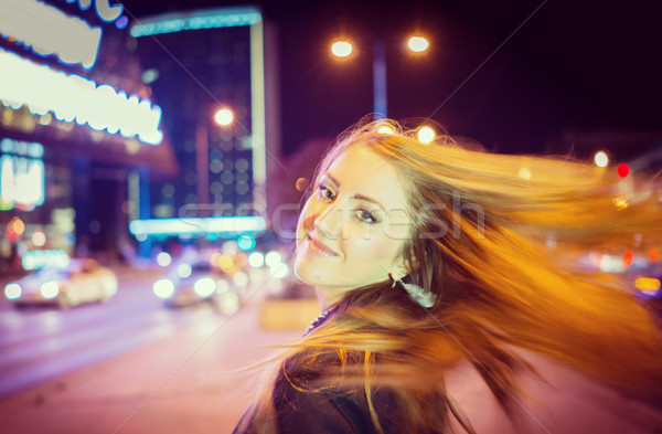 Young woman dancing with hair on the night city street Stock photo © zurijeta