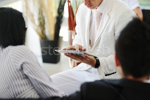 Portrait of modern couple talking to manager while discussing co Stock photo © zurijeta