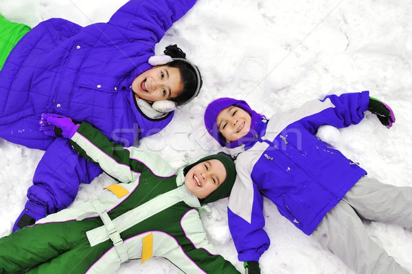 Happy children on snow Stock photo © zurijeta