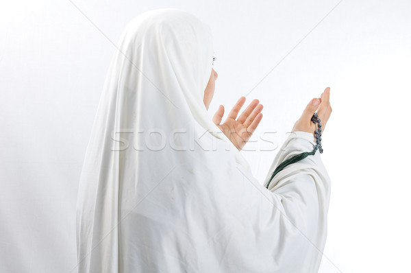 Veiled woman praying Stock photo © zurijeta