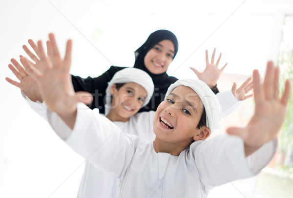 Happy Arabic family having fun at home Stock photo © zurijeta