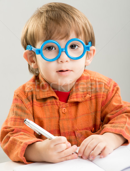 Stock photo: Adorable baby learning and getting ready for school in kindergar