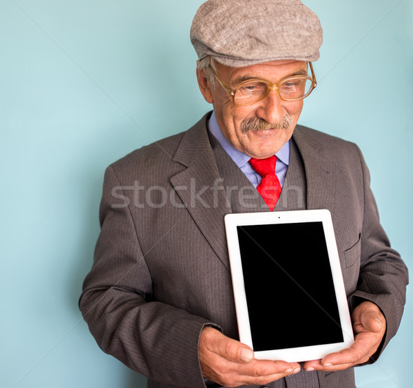 Portrait of a smiling and confident mature businessman with must Stock photo © zurijeta