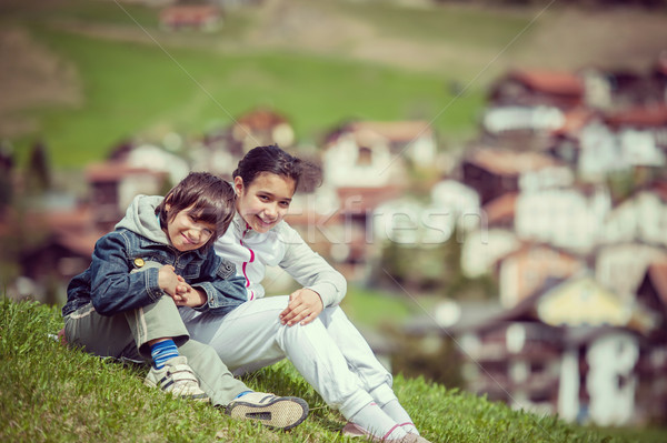 Boy and girl having beautiful spring vacation in idyllic Alps Stock photo © zurijeta
