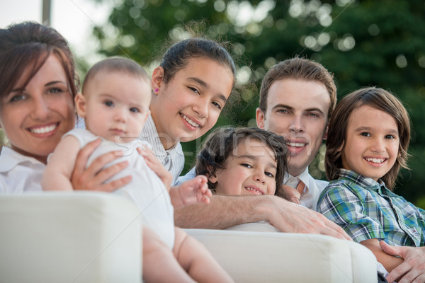 Happy parents with three children Stock photo © zurijeta