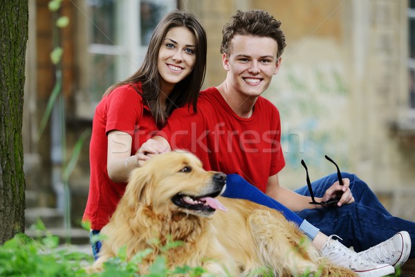 Young real people on the street with dog Stock photo © zurijeta