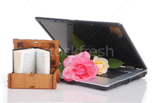 Beautiful roses, laptop and Islam holy book, put together isolated Stock photo © zurijeta