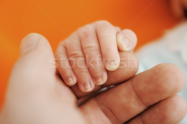 Newborn baby hand on hands Stock photo © zurijeta