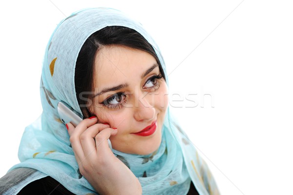 Arabic girl talking on cell phone Stock photo © zurijeta