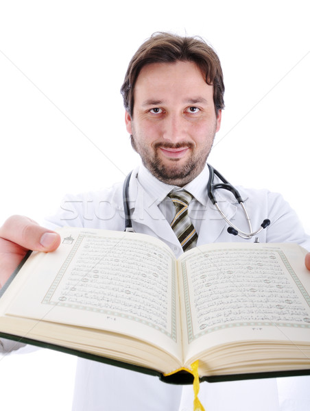 Muslim doctor with Koran in hands showing you open pages Stock photo © zurijeta