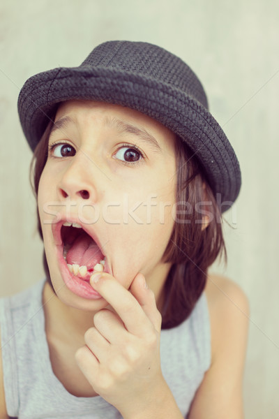 Happy little kid with tooth down Stock photo © zurijeta