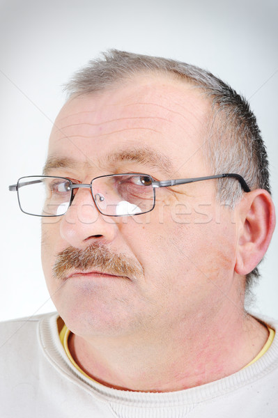 Ouderen man bril portret glimlach gelukkig Stockfoto © zurijeta