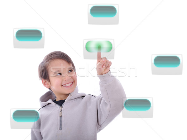 Little cute child pressing digital buttons on touchscreen, ideal for your concept Stock photo © zurijeta