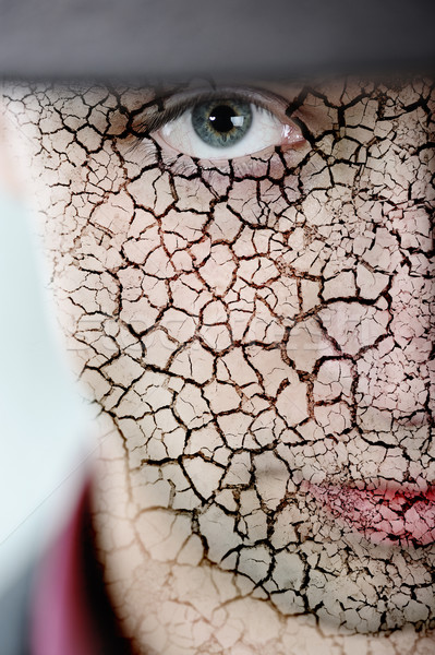 Junger Mann geknackt Haut Gesicht Mann Augen Stock foto © zurijeta