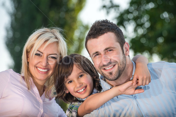 Happy family hugging Stock photo © zurijeta