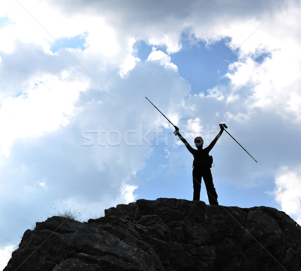 Silhouette of a woman during and adventage climbing and mountain walking Stock photo © zurijeta