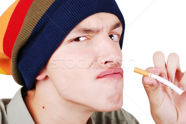 Funny face young man with cigarete in hand Stock photo © zurijeta