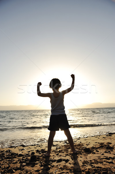 Kid on sea, silhouette Stock photo © zurijeta