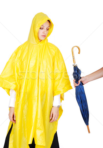 Stock photo: Nice model in yellow hood has been offered an umbrella