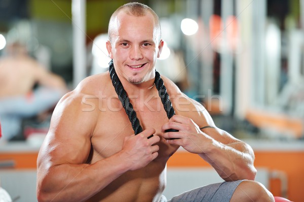 Athletic bodybuilder, execute exercise in sport gym hall Stock photo © zurijeta
