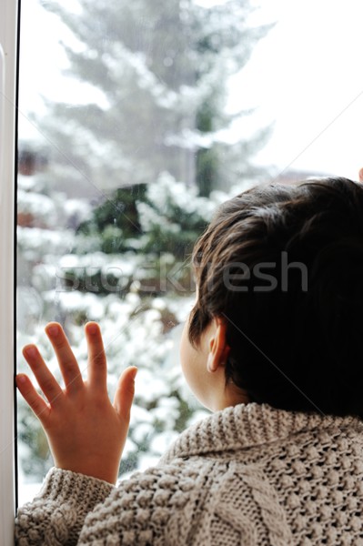 Sad kid waiting in his room for the winter snow Stock photo © zurijeta