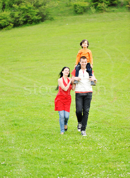 running family on green meadow in nature Stock photo © zurijeta