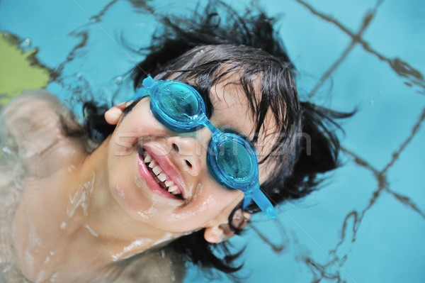 Children activities in swimming pool Stock photo © zurijeta