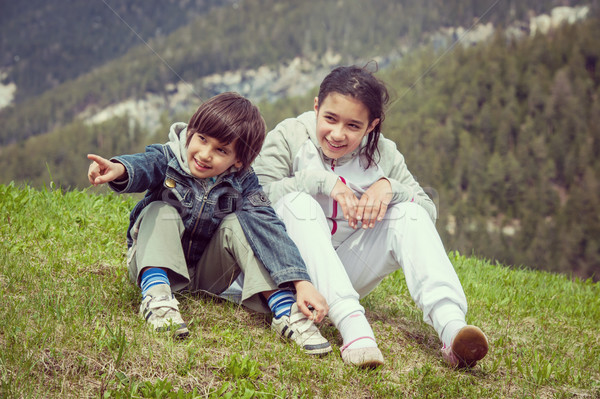 Boy and girl having beautiful spring vacation in idyllic Alps Stock photo © zurijeta