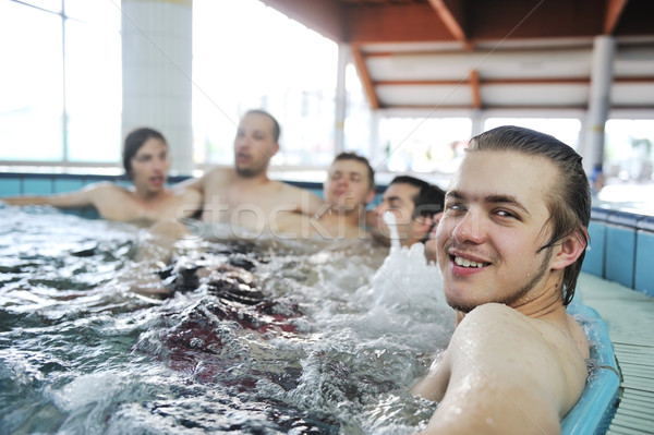 Relaxing in hot tube, jacuzzy, group of young people, friends together Stock photo © zurijeta