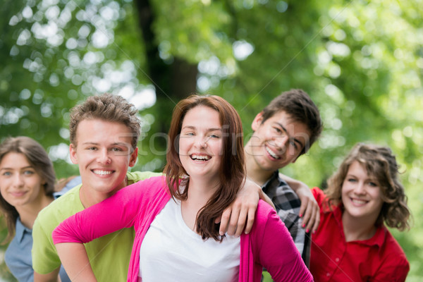 молодые люди лесу группа улыбаясь позируют природы Сток-фото © zurijeta