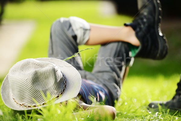 Relaxed child resting on summer park grass meadow Stock photo © zurijeta