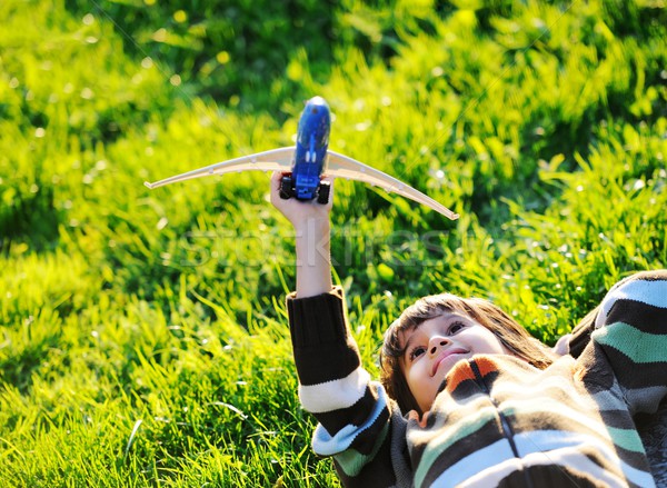 Happy kid enjoying sunny late summer and autumn day in nature on Stock photo © zurijeta