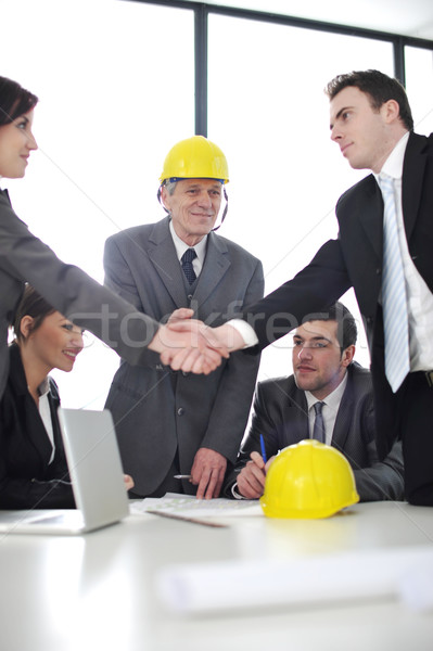 Business partners discussing documents and ideas at meeting Stock photo © zurijeta