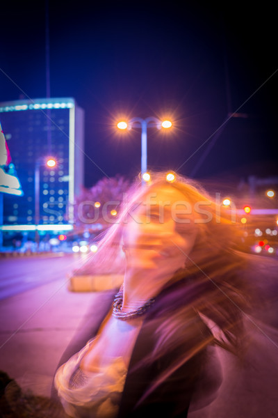Young woman dancing with hair on the night city street Stock photo © zurijeta