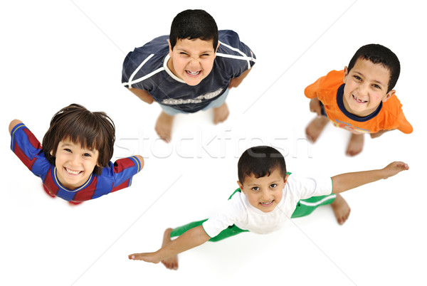 Happy child, positive fresh little smiling boy from above, diffe Stock photo © zurijeta