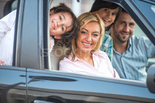 Smiling family in automobile Stock photo © zurijeta