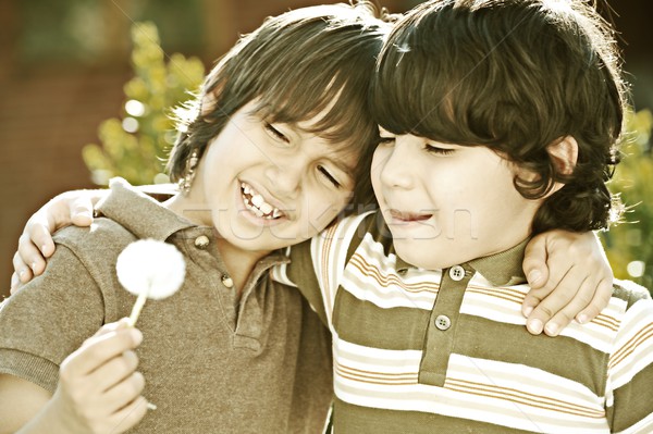 Stock photo: Cheerful children enjoying childhood colorized