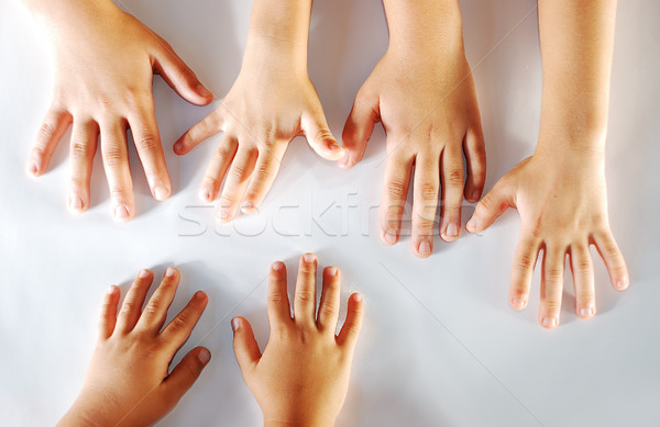 Vários crianças mãos juntos branco mão Foto stock © zurijeta