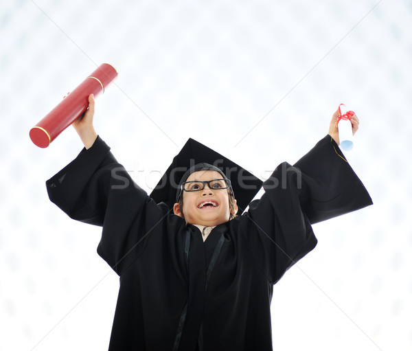 Kid celebrating graduating diploma Stock photo © zurijeta