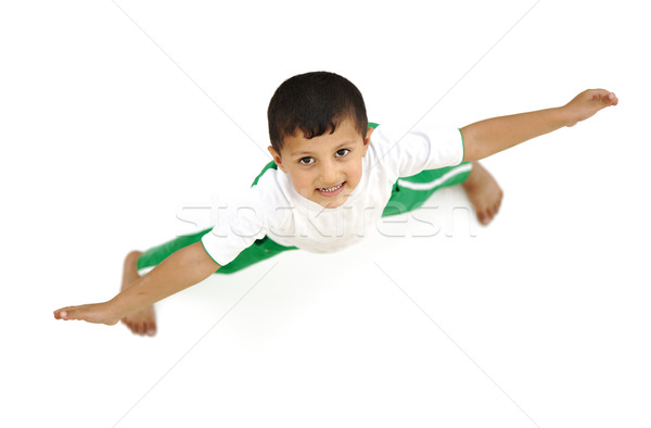 Happy child, positive fresh little boy from above, different angle, isolated on white, opened arms Stock photo © zurijeta