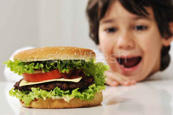 Cute child with burger Stock photo © zurijeta